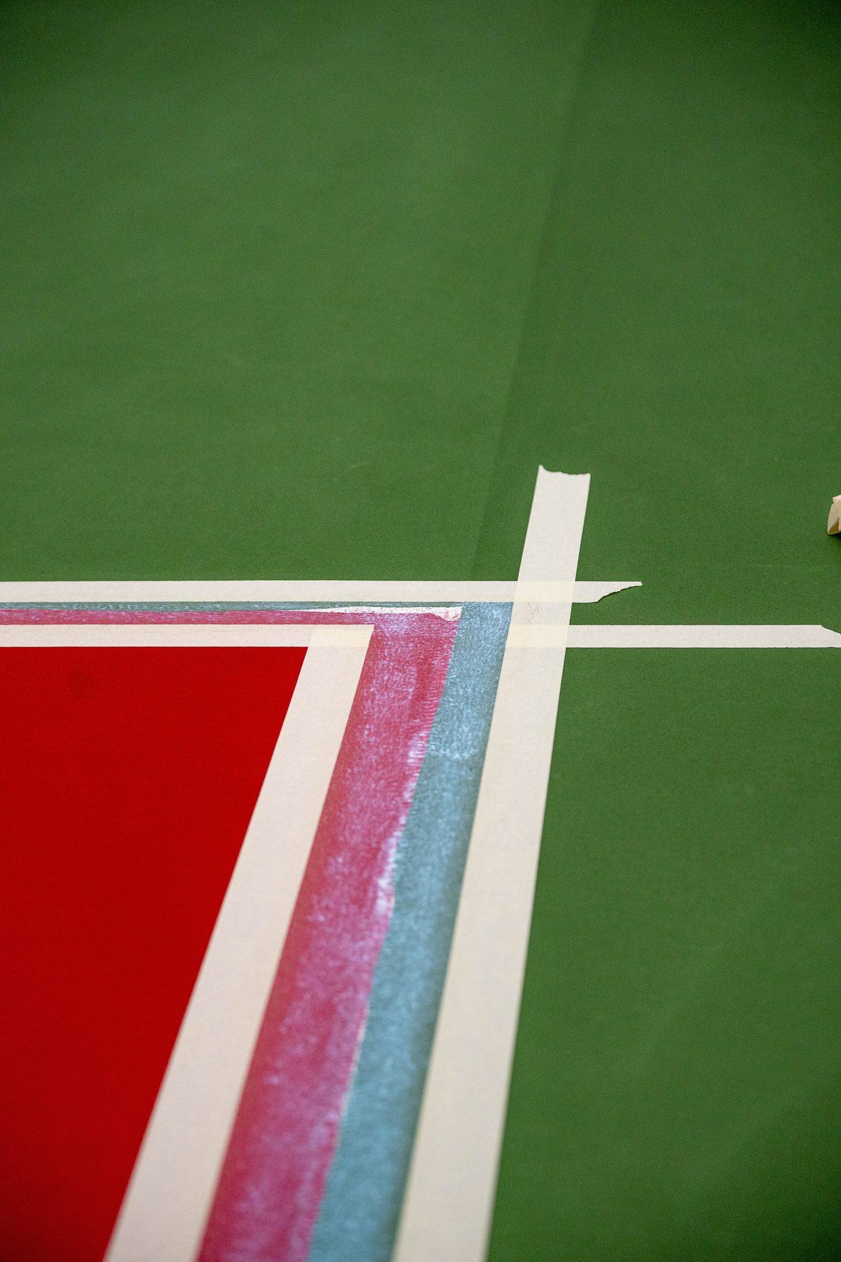 Fresh white line on red and green Laykold at the University of Oklahoma